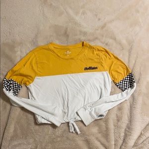 A yellow/white/checkered longsleeve Hollister top.